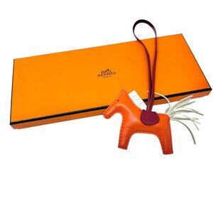 HERMES Rodeo PM in Orange Poppy, Craie, and Terre Battue in Milo Lambskin Leathe